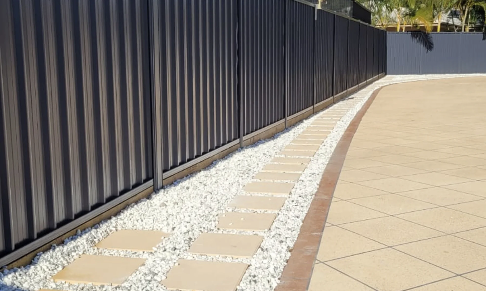Colorbond fence and paved entertaining area